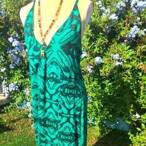 Spaghetti dress w/ slit down the middle a patterning black water color on green